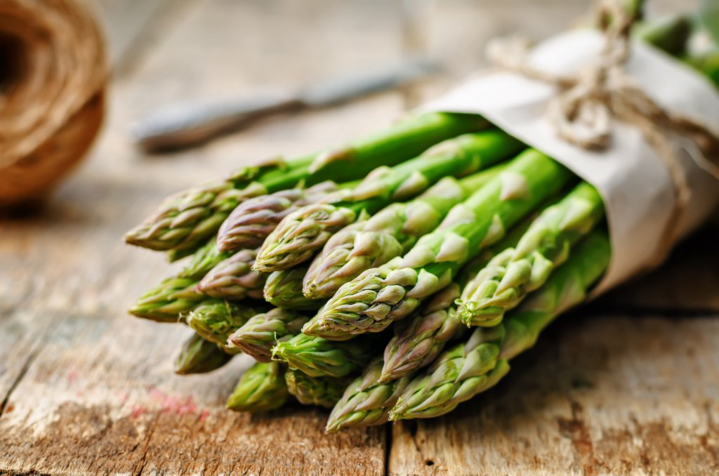 asparagus on a dark wood background. the toning. selective focus