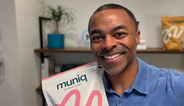 Muniq founder and ceo holding a bag of Muniq shakes