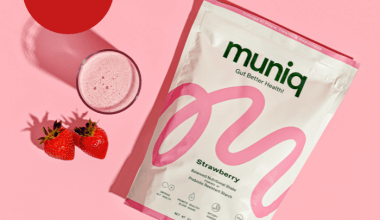A picture of a strawberry shake and strawberries with a product bag